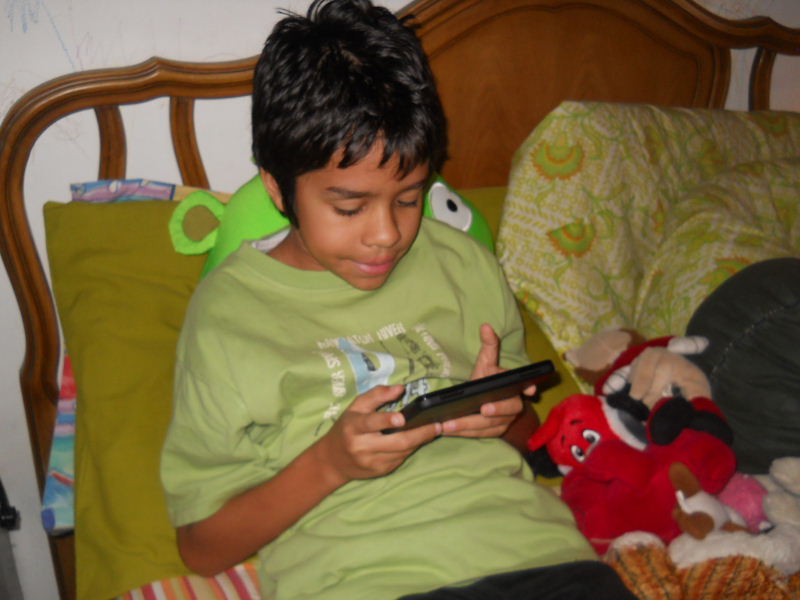 Reading from his Kindle Fire